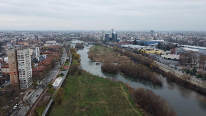 A River in Between Buildings in Drone Photography