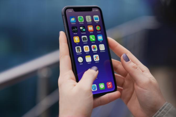 Two hands holding up a smartphone