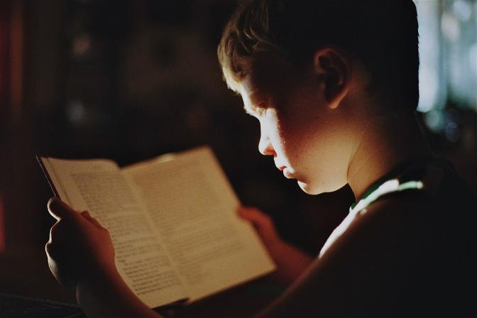 A boy reading a book