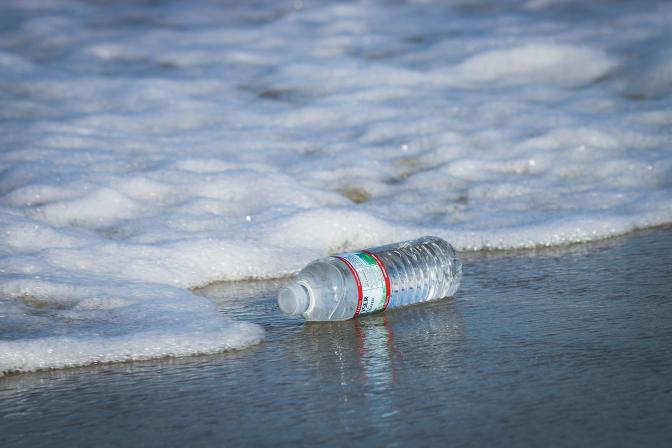 water plastic bottle on seashore