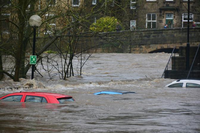 cars submerged under flood waters