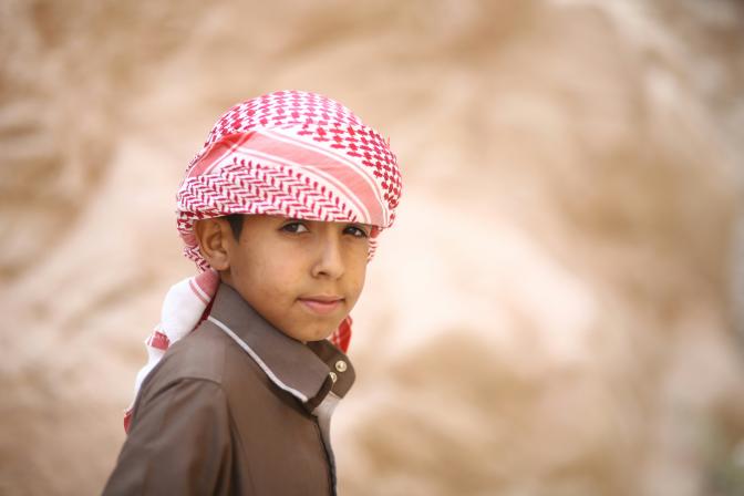 boy with keffiyeh headdress