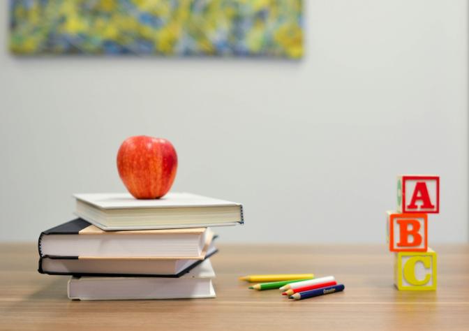 apple on pile of books