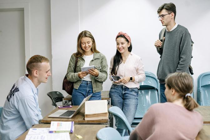 group of people talking in a classroom